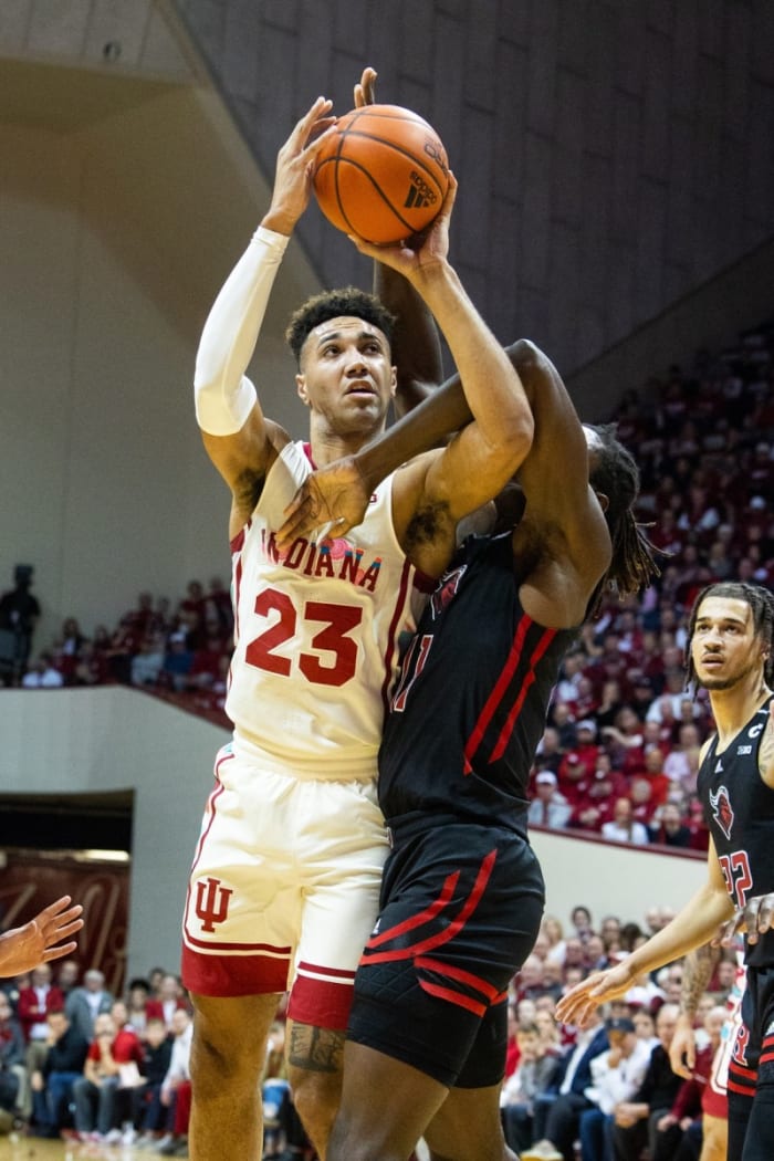 Trayce Jackson-Davis (23) shoots the ball while Rutgers Scarlet Knights center Clifford Omoruyi (11) defends.